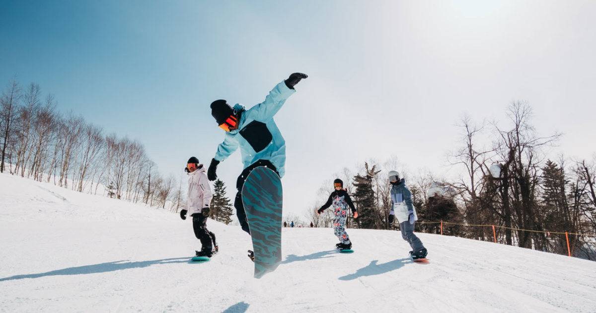 Burton's ambassador brand engagement; four snowboarders in action.