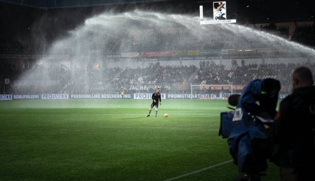 camera shooting athlete on field for DAM system