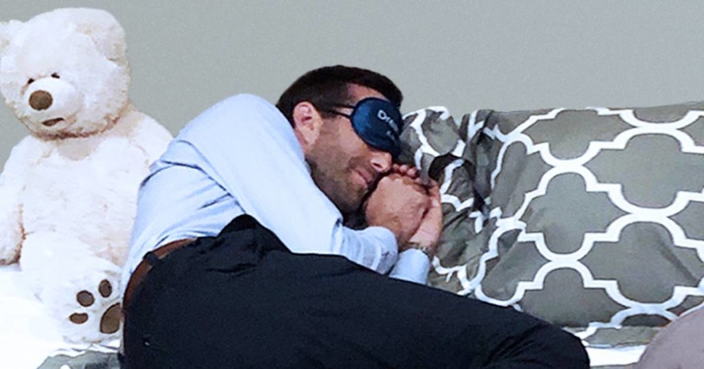 Man with sleep mask pretending to sleep as part of Worldz session social storytelling activity