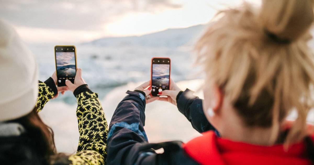 user-generated-content - two women holding mobile phones